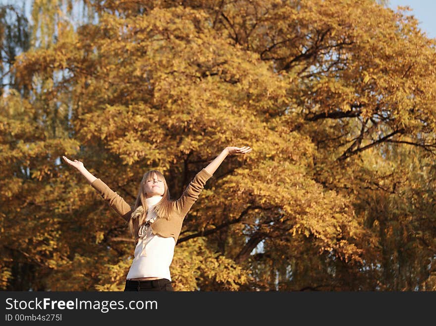 Portrait of a young girl raise hands up. Portrait of a young girl raise hands up