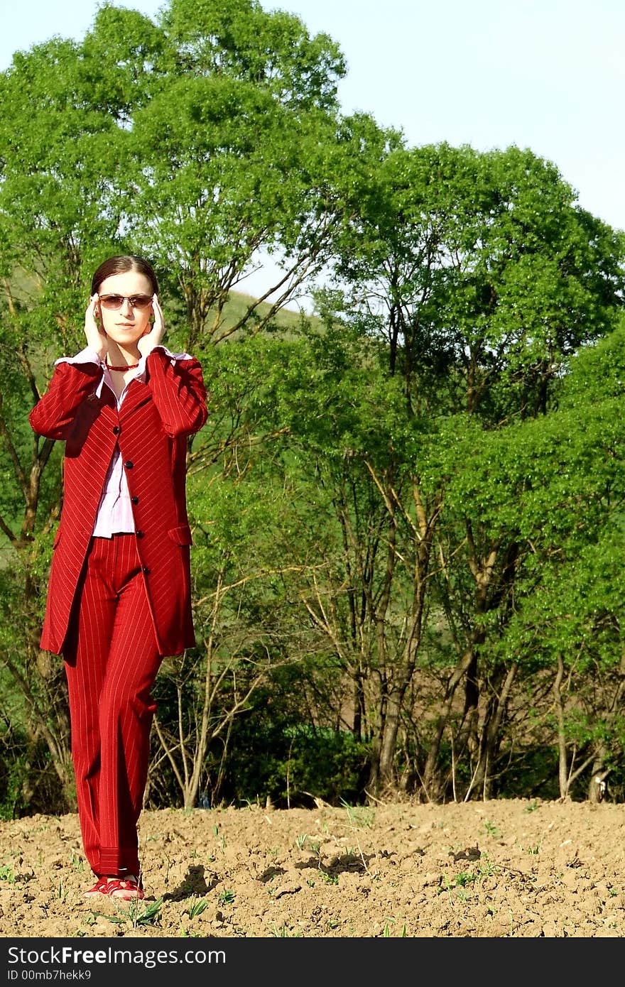 A picture of a business woman outdoor in wilderness. A picture of a business woman outdoor in wilderness.