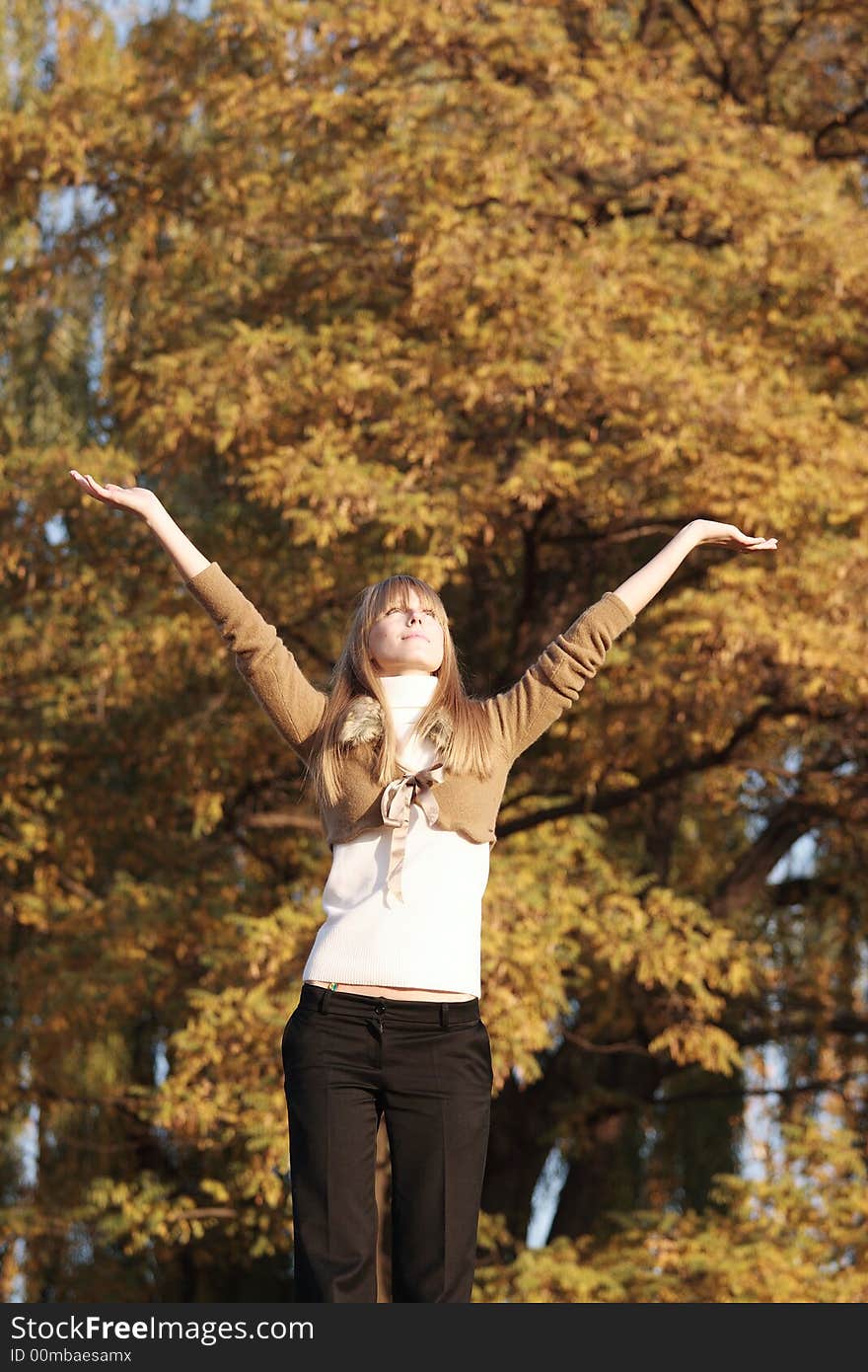 Portrait of a young girl raise hands up. Portrait of a young girl raise hands up