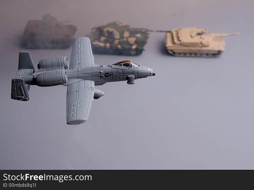 Plane showing a battle field escorting tank. Plane showing a battle field escorting tank.