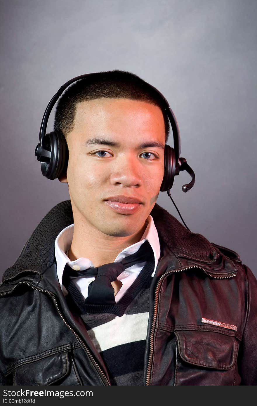 Man smilling with headset on his ear. Man smilling with headset on his ear.