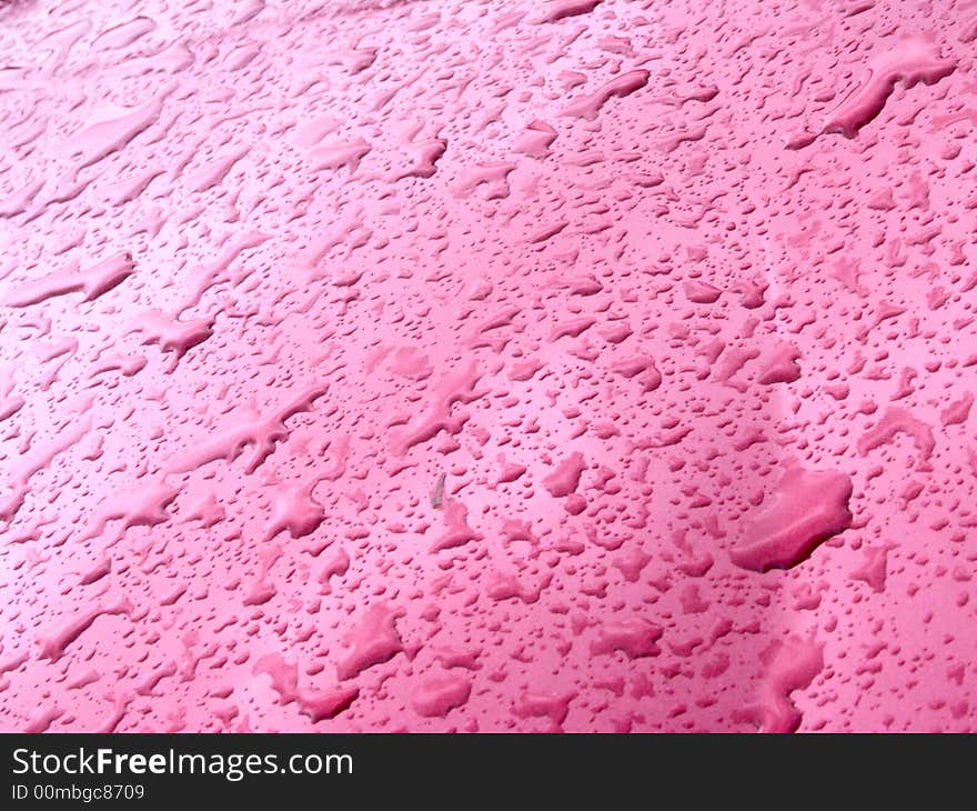 Water drops on pink metal. Water drops on pink metal