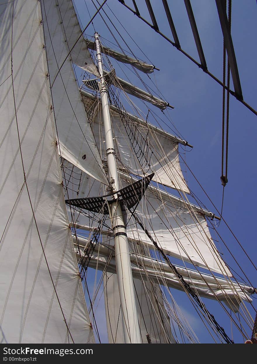 Detail of a mast and sail of a large sailboat.