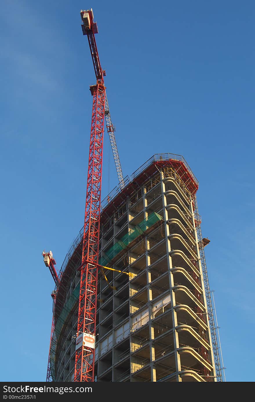 Crane attached to raising skyscraper. Crane attached to raising skyscraper