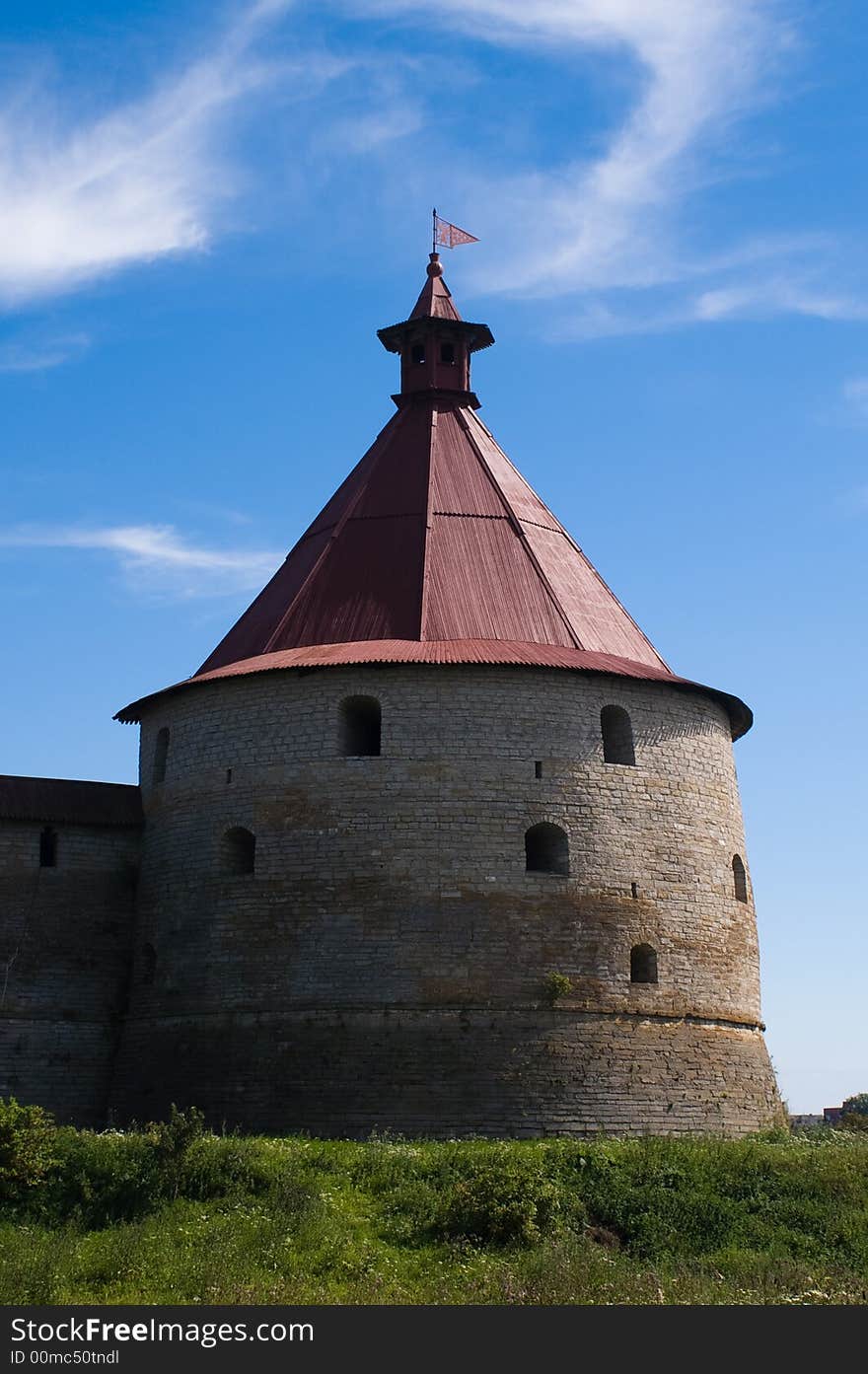 Ancient castle tower at sunny summer day