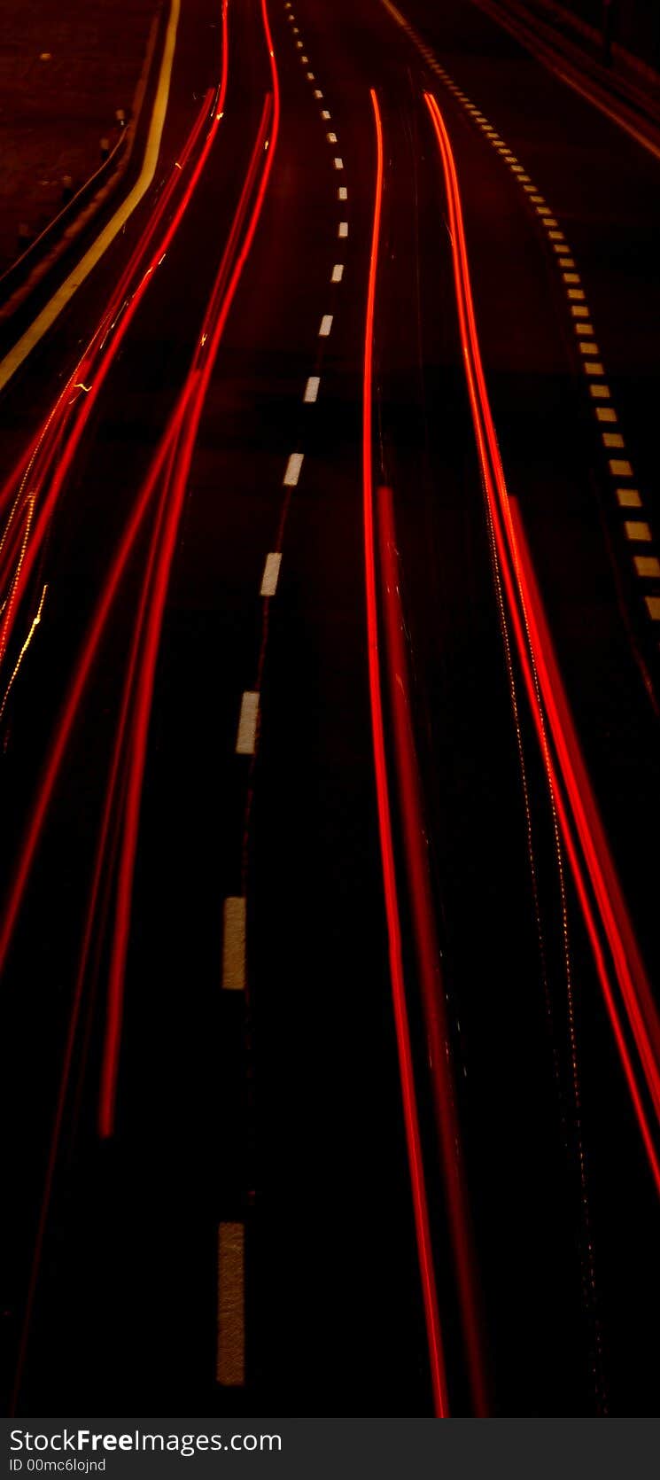 Night highway with tracks of red brake lights. Night highway with tracks of red brake lights.