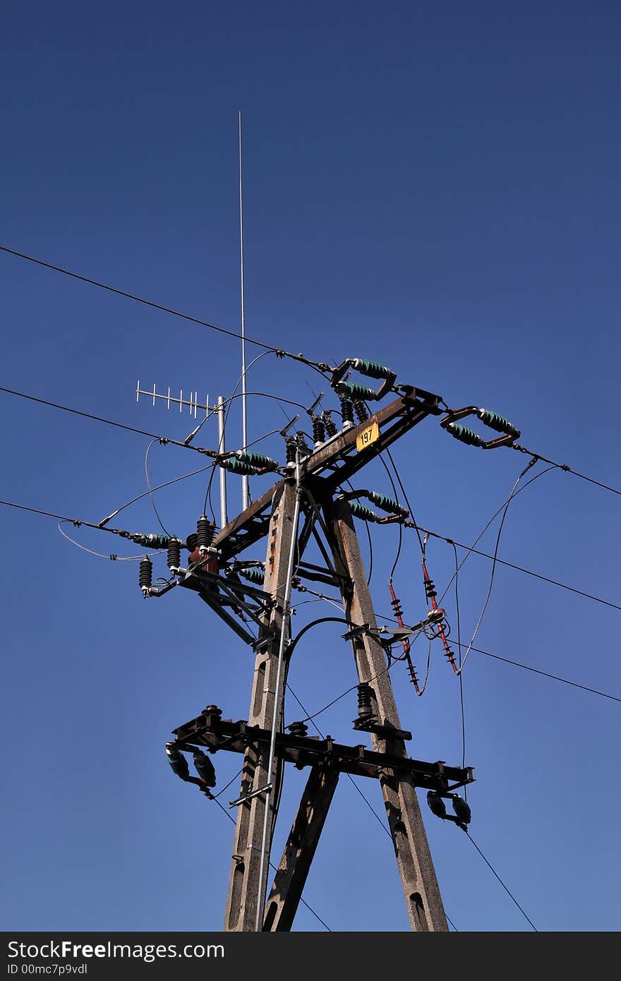 Electric post and blue sky