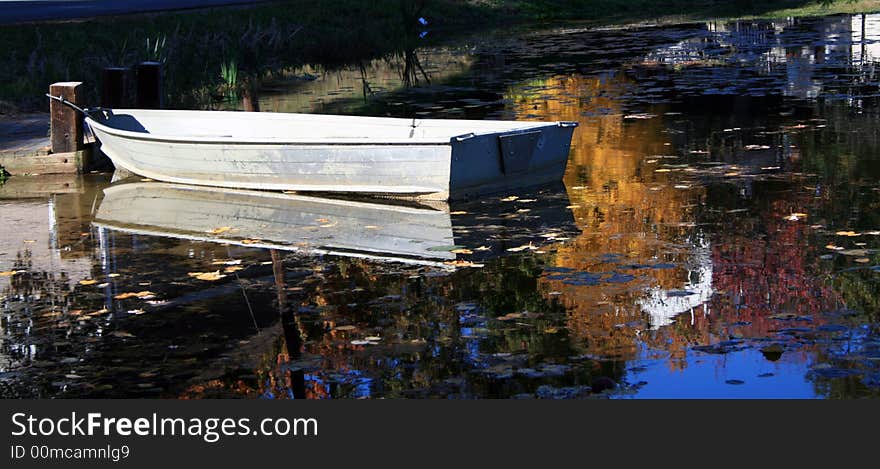 Fall Row Boat Reflection