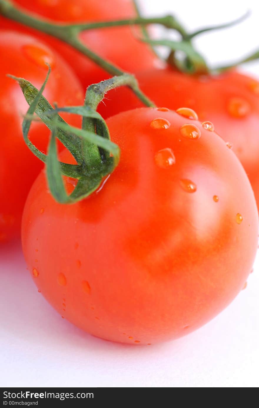 Bunch of tomatoes on a white background