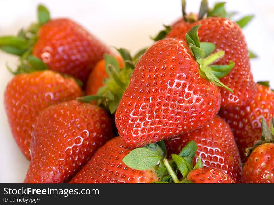 A close up of freshly picked red strawberries. A close up of freshly picked red strawberries