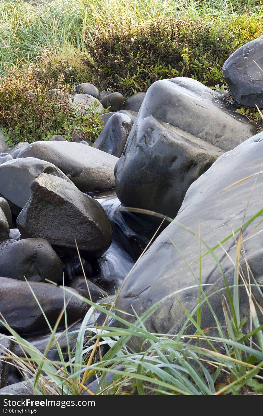 Pile of stones around a creek