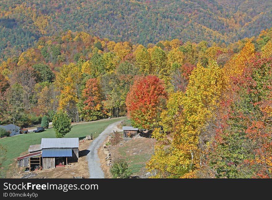 Colorful autumn mountain scene with rustic buildings. Colorful autumn mountain scene with rustic buildings