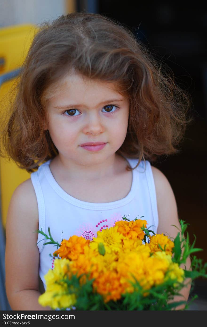 Beautiful girl with face expression, yellow flowers in hand. Beautiful girl with face expression, yellow flowers in hand