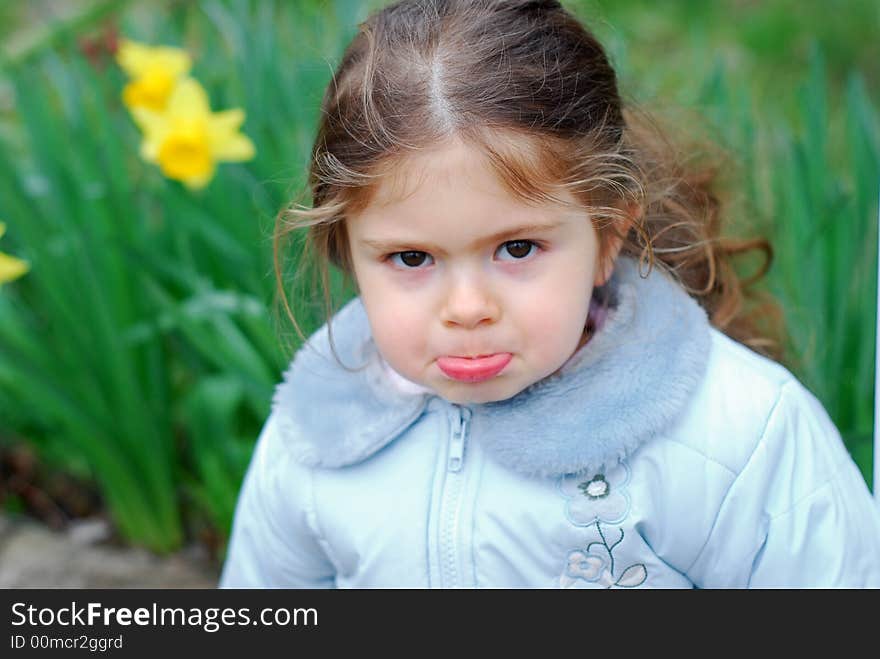 Beautiful girl with face expression, yellow flower in backround. Beautiful girl with face expression, yellow flower in backround