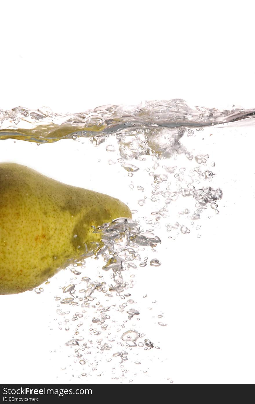 A pear falling in water. A pear falling in water