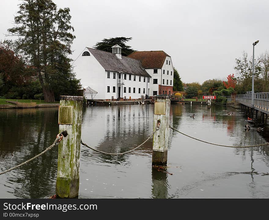 Autumn scene of an Historic Mill on the River Thames in England with Canada Geese in the foreground