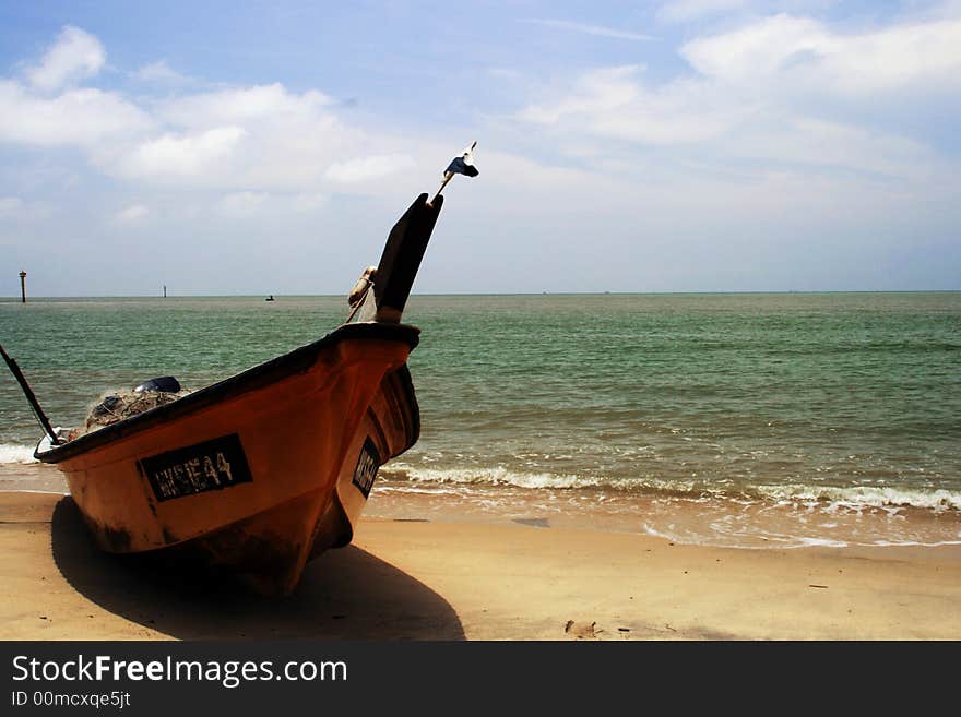 A boat sitting on a beach. A boat sitting on a beach.