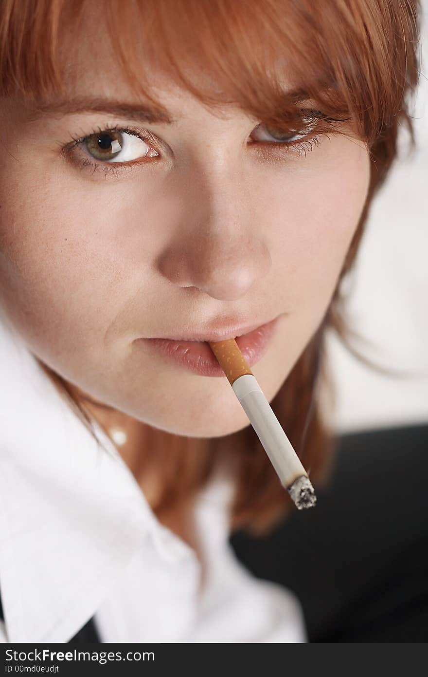 Businesswoman with cigarette