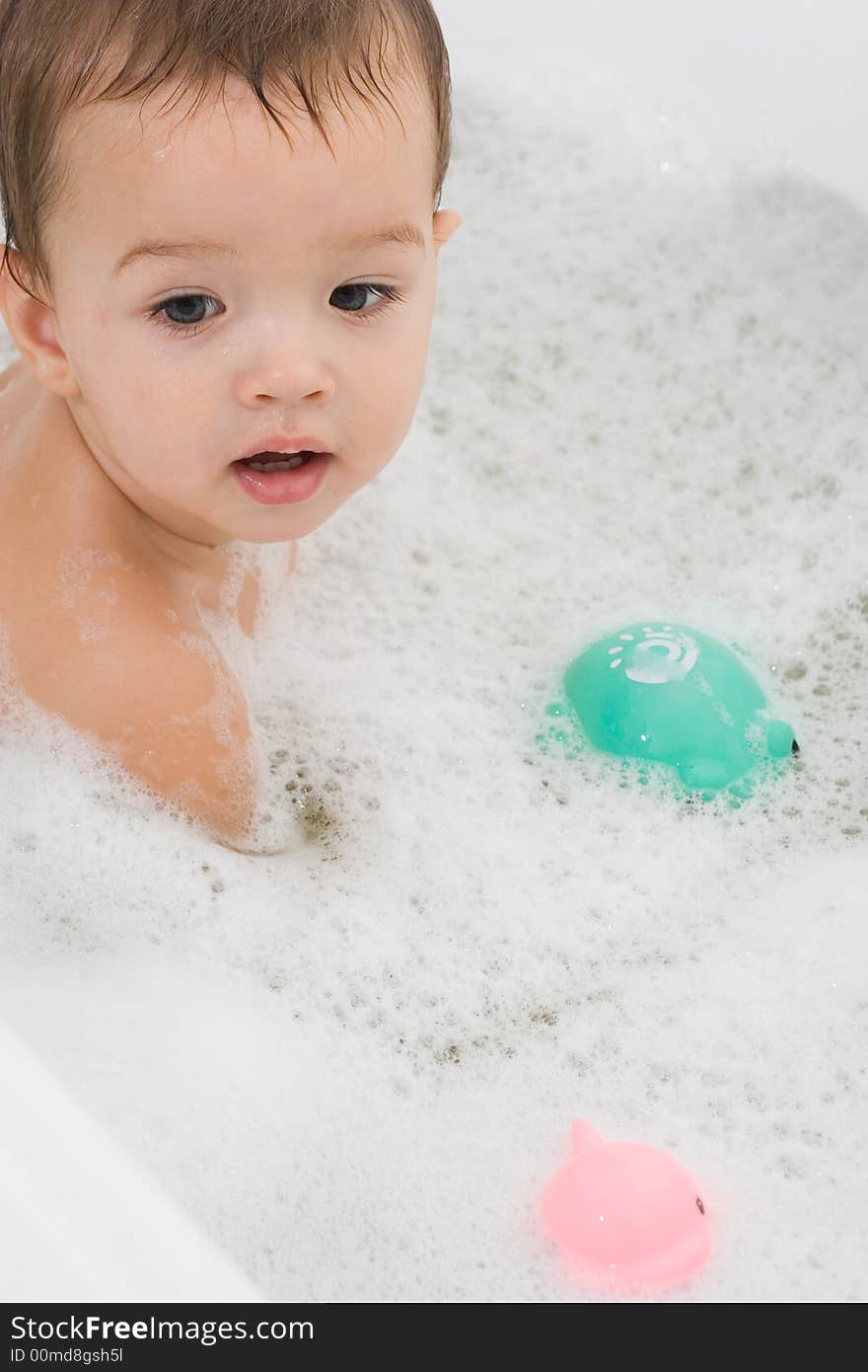 Happy Child is bathing with toys. Happy Child is bathing with toys