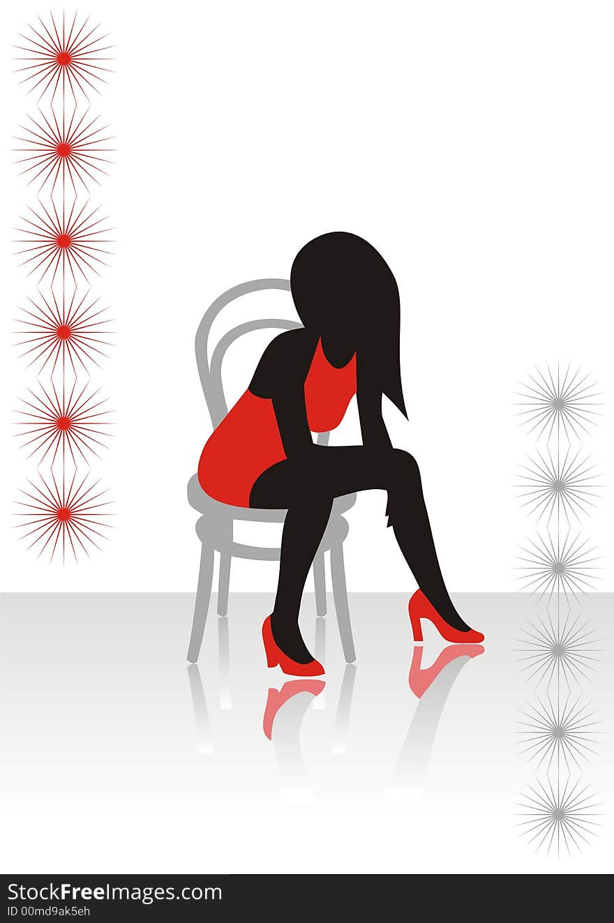 The beautiful girl in a red dress sits on a chair