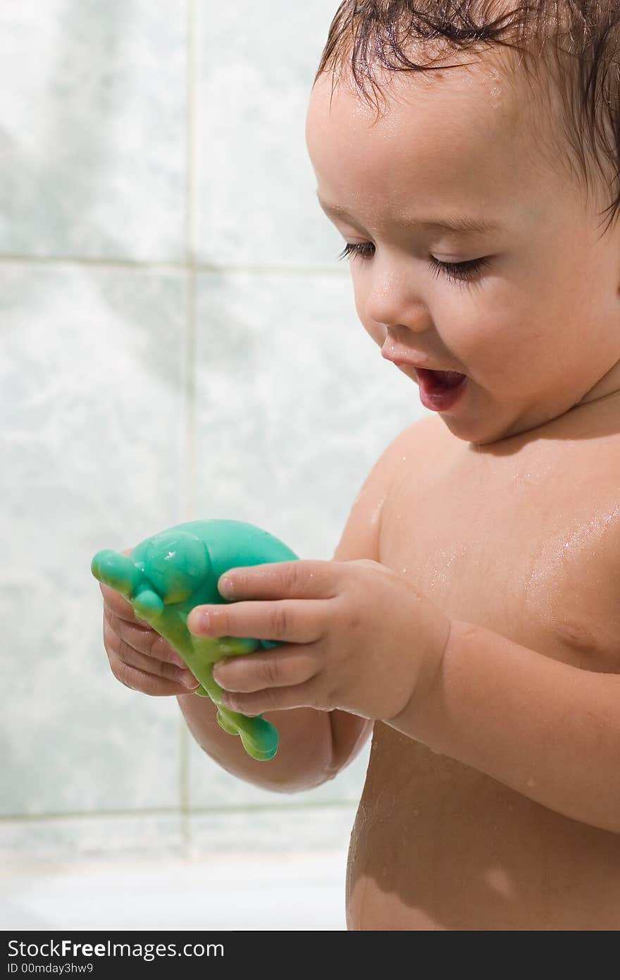 Happy Child is bathing with toys. Happy Child is bathing with toys