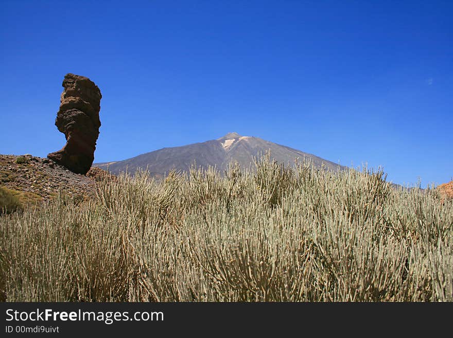 The huge pumice and unstable rock of Garcia is seen in forefront with the volcano Teide in background, the clear patches of the volcano are sulfur rocks. The huge pumice and unstable rock of Garcia is seen in forefront with the volcano Teide in background, the clear patches of the volcano are sulfur rocks