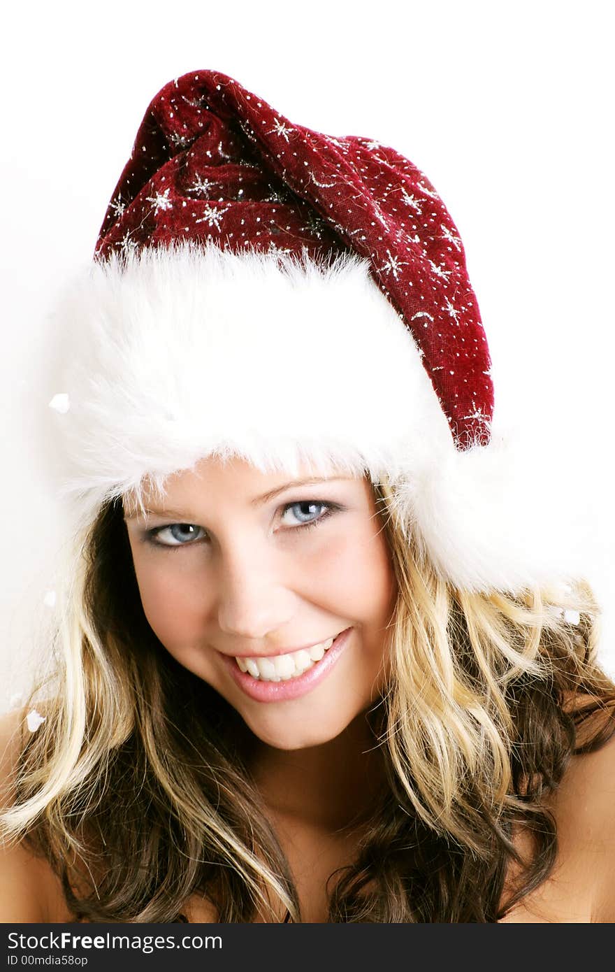 Winter portrait of a beautiful young woman with a cap against white background. Winter portrait of a beautiful young woman with a cap against white background