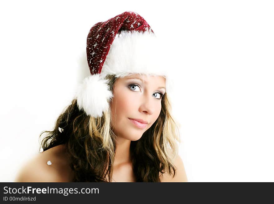 Winter portrait of a beautiful young woman with a cap against white background. Winter portrait of a beautiful young woman with a cap against white background