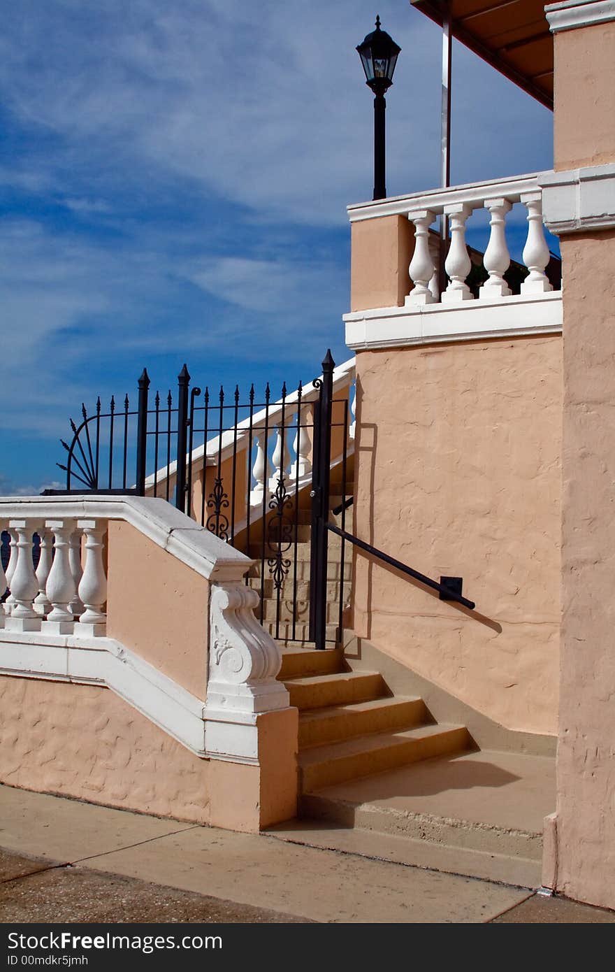 The back portion of an aging condominium building against a blue sky. The back portion of an aging condominium building against a blue sky