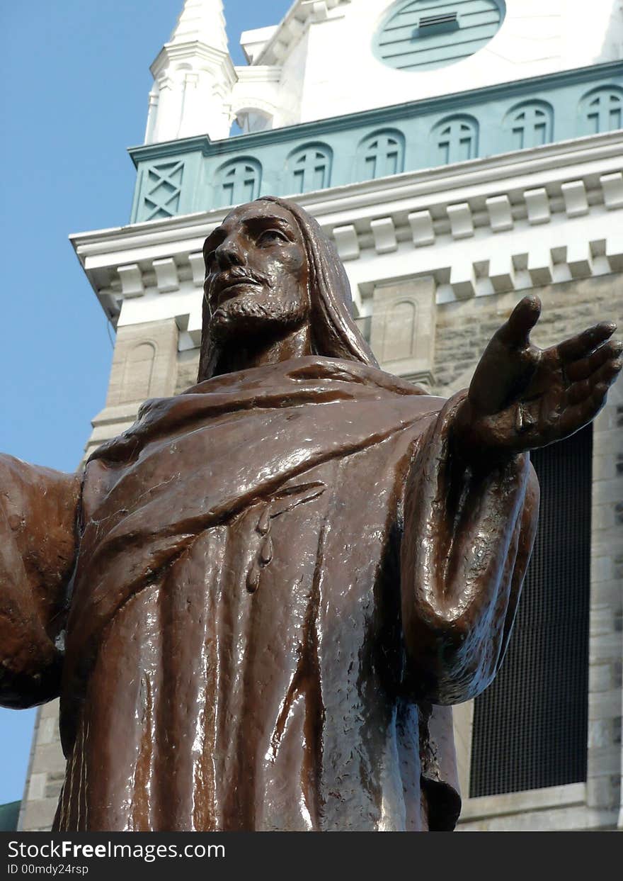 Jesus statue with open arms in front of Catholic church. Jesus statue with open arms in front of Catholic church