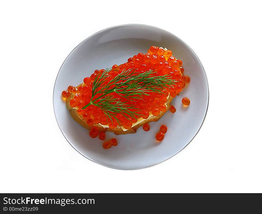 Sandwich with red caviar on a plate