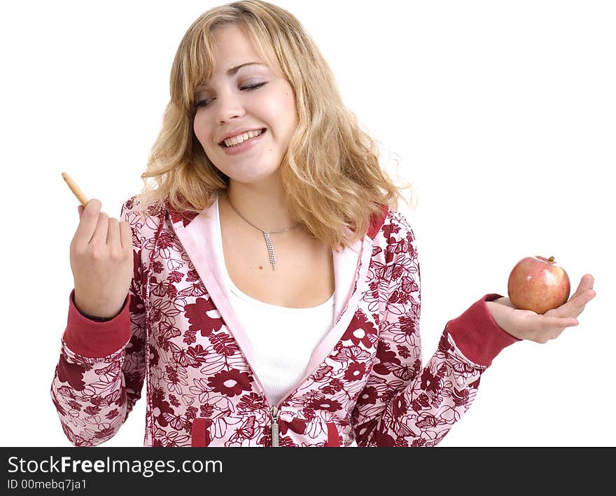 Teenage girl deciding between a nutritious snack and a sugary one. Teenage girl deciding between a nutritious snack and a sugary one.