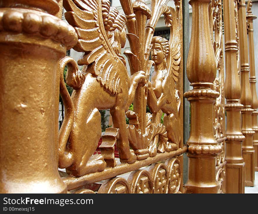 Ornate gold gates with griffins. Ornate gold gates with griffins