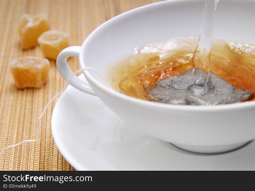 Hot water in a cup with a teabag. Hot water in a cup with a teabag