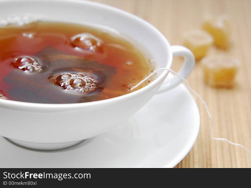 Hot water in a cup with a teabag. Hot water in a cup with a teabag