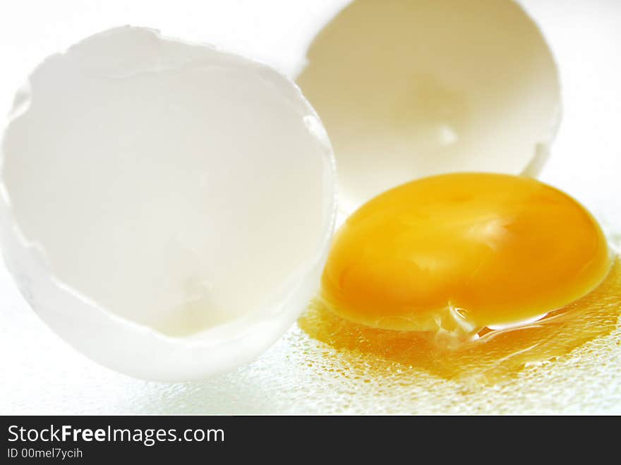 Brocken egg in front of a white background