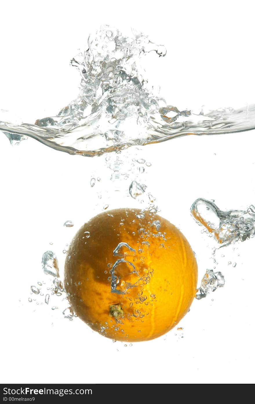 An orange falling in water