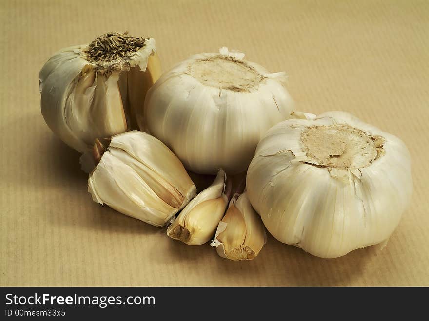 Garlic on brown paper horizontal, individual cloves. Garlic on brown paper horizontal, individual cloves