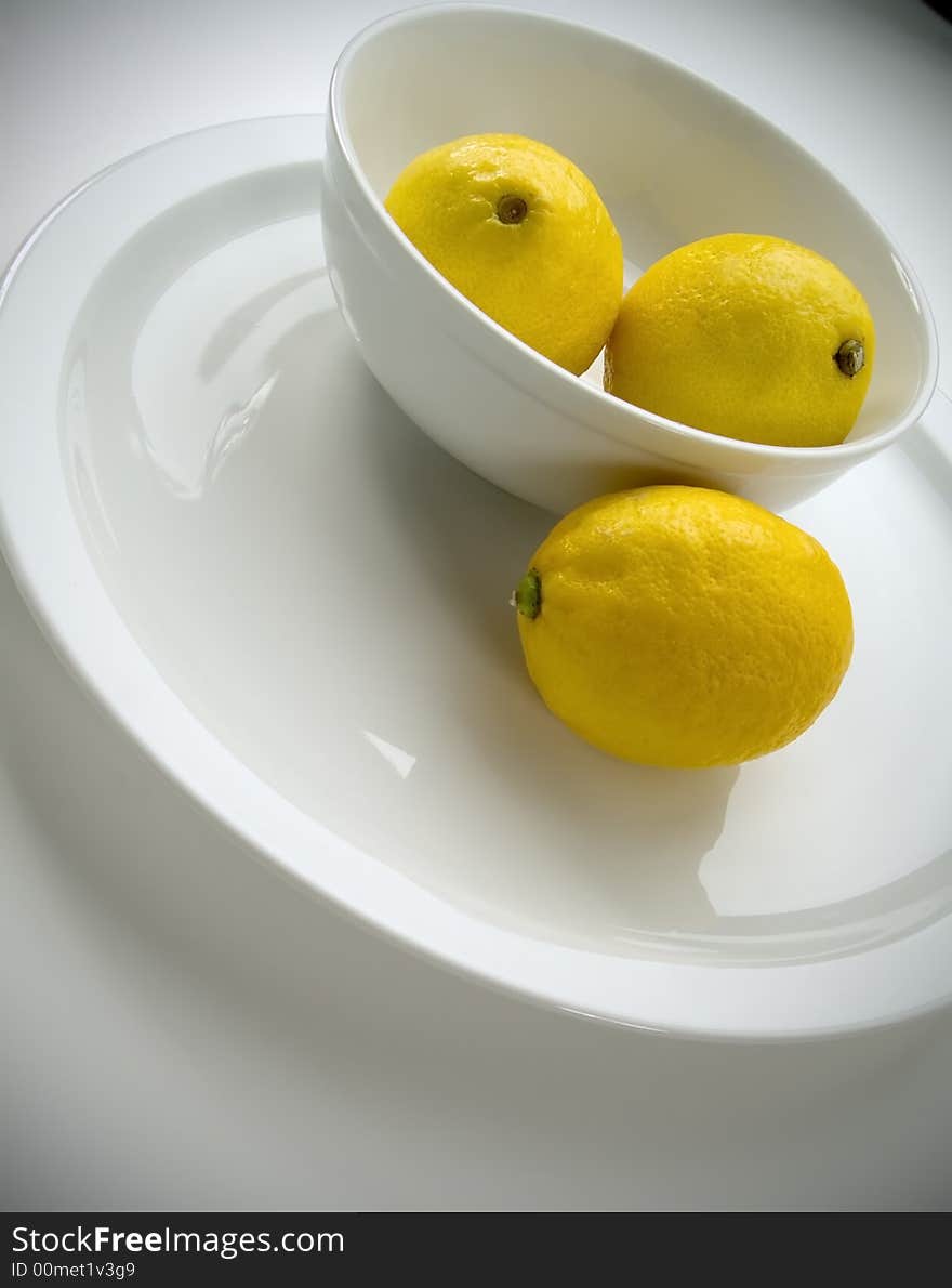 3 lemons in a bowl