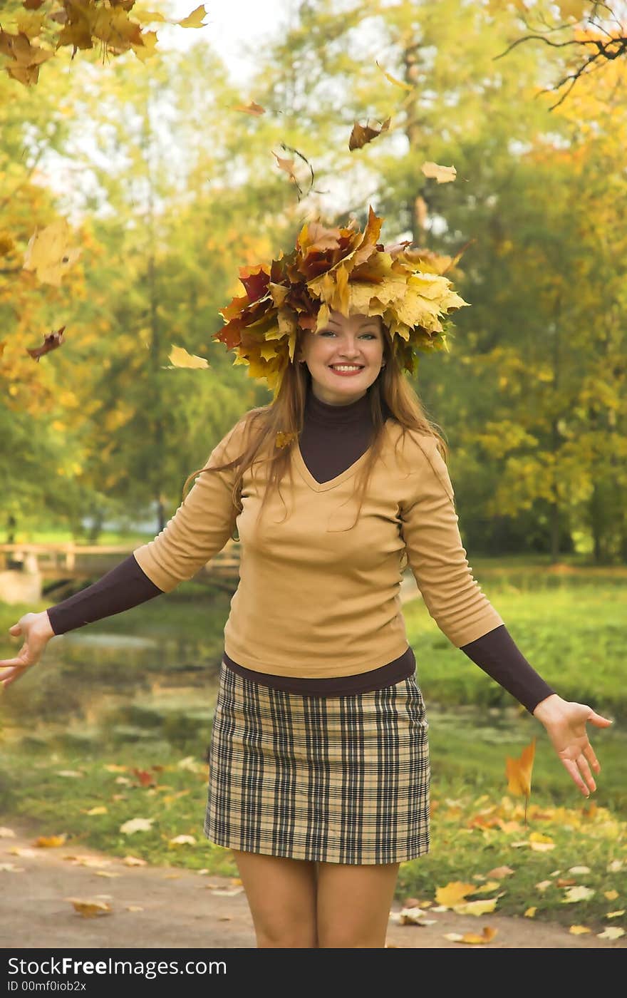 The cheerful girl on rest in autumn park