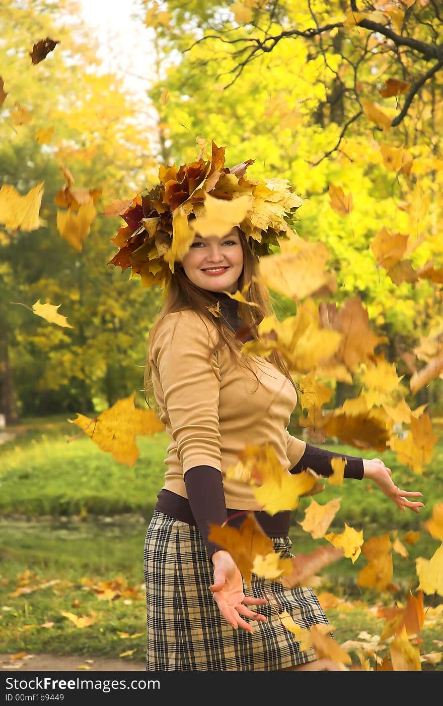 The cheerful girl on rest in autumn park