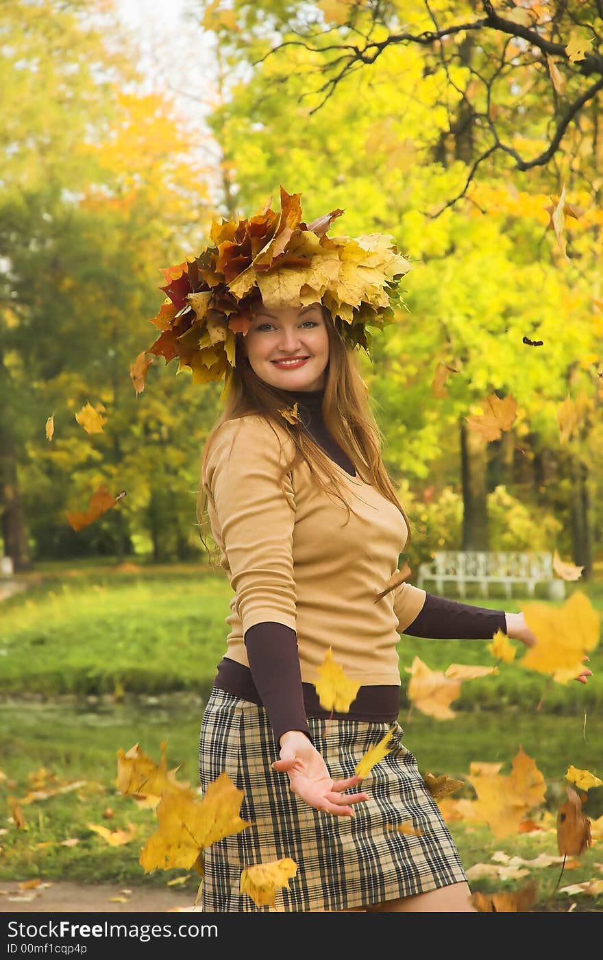 The cheerful girl on rest in autumn park