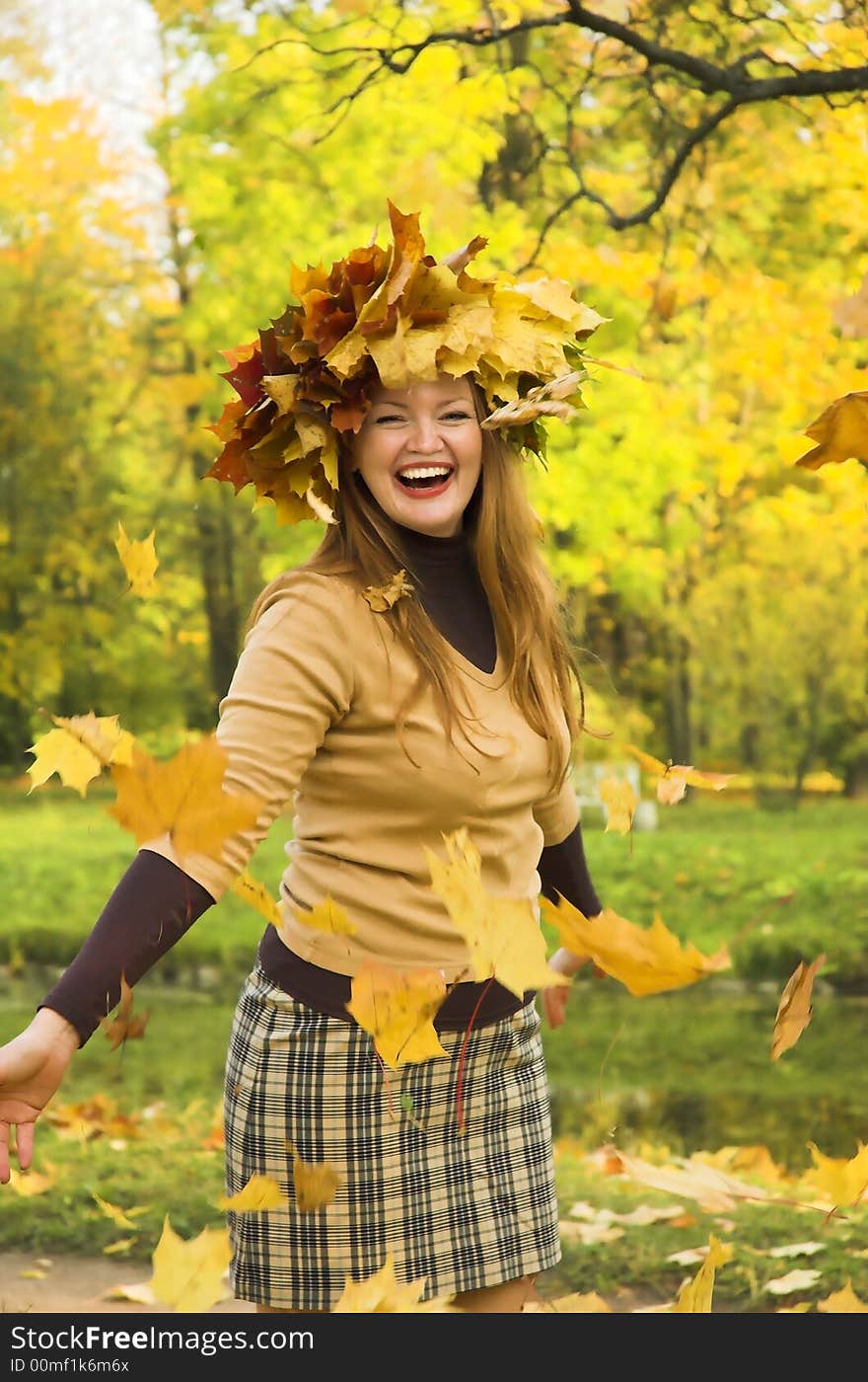 The cheerful girl on rest in autumn park