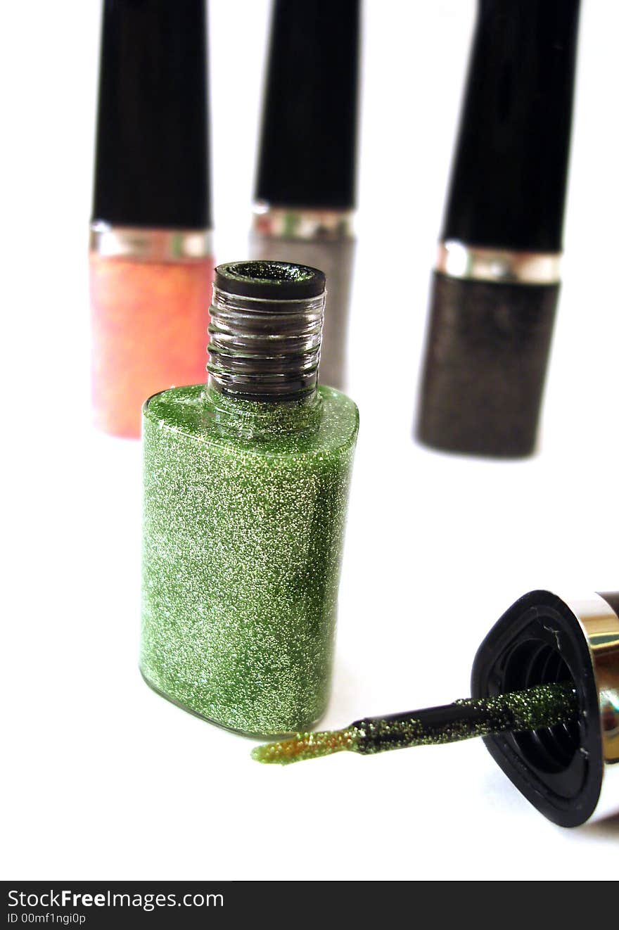 Green nail polish or lipstick on white background