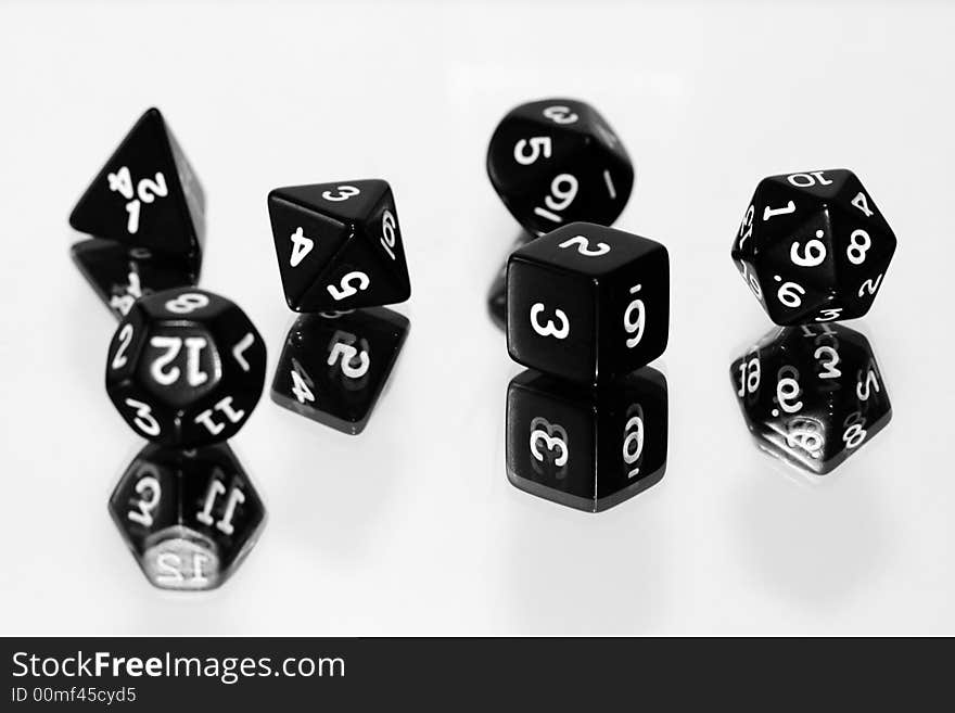 Black dice on white background - shallow depth of field