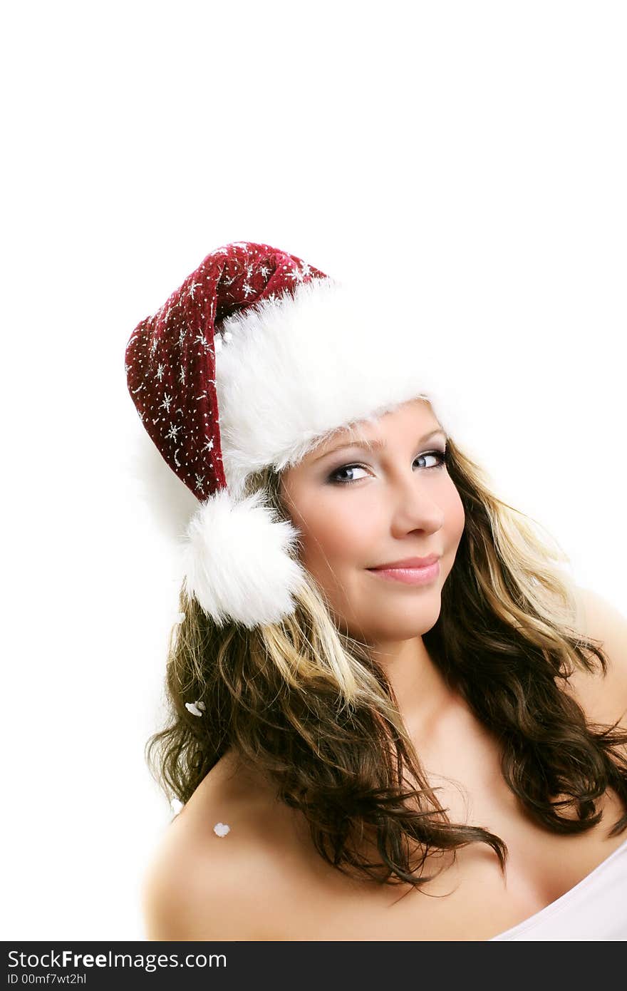 Winter portrait of a beautiful young woman with a cap against white background. Winter portrait of a beautiful young woman with a cap against white background