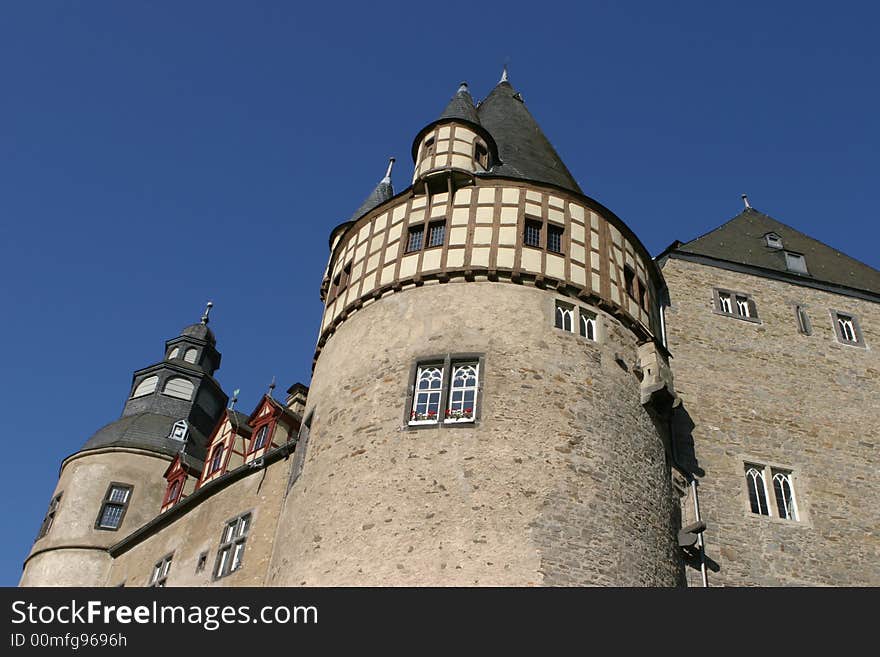 Medieval castle in Germany standing in the bright sunlight of a clear autumn day. Medieval castle in Germany standing in the bright sunlight of a clear autumn day