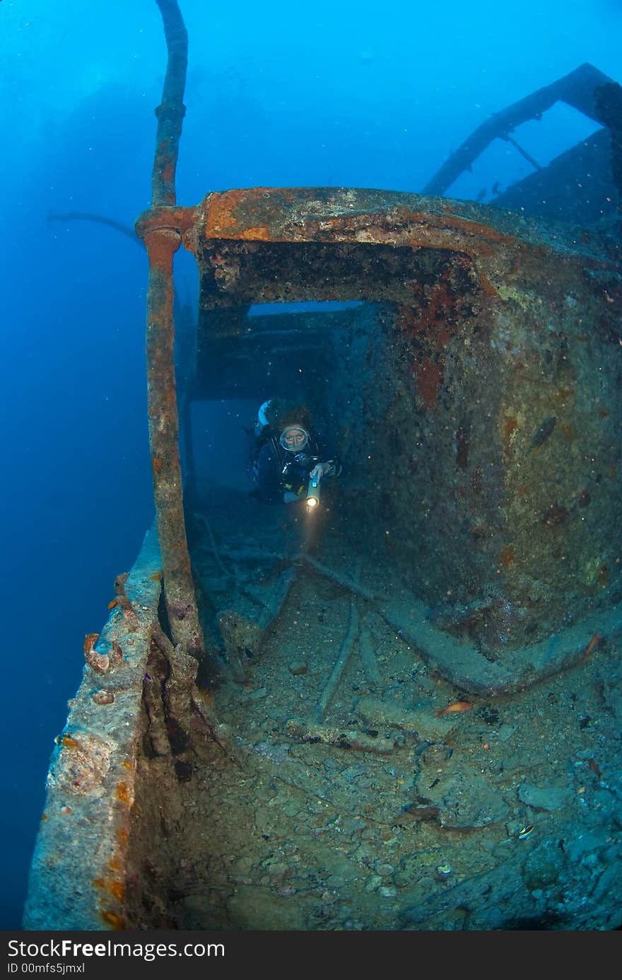 Woman diver on ship wreck