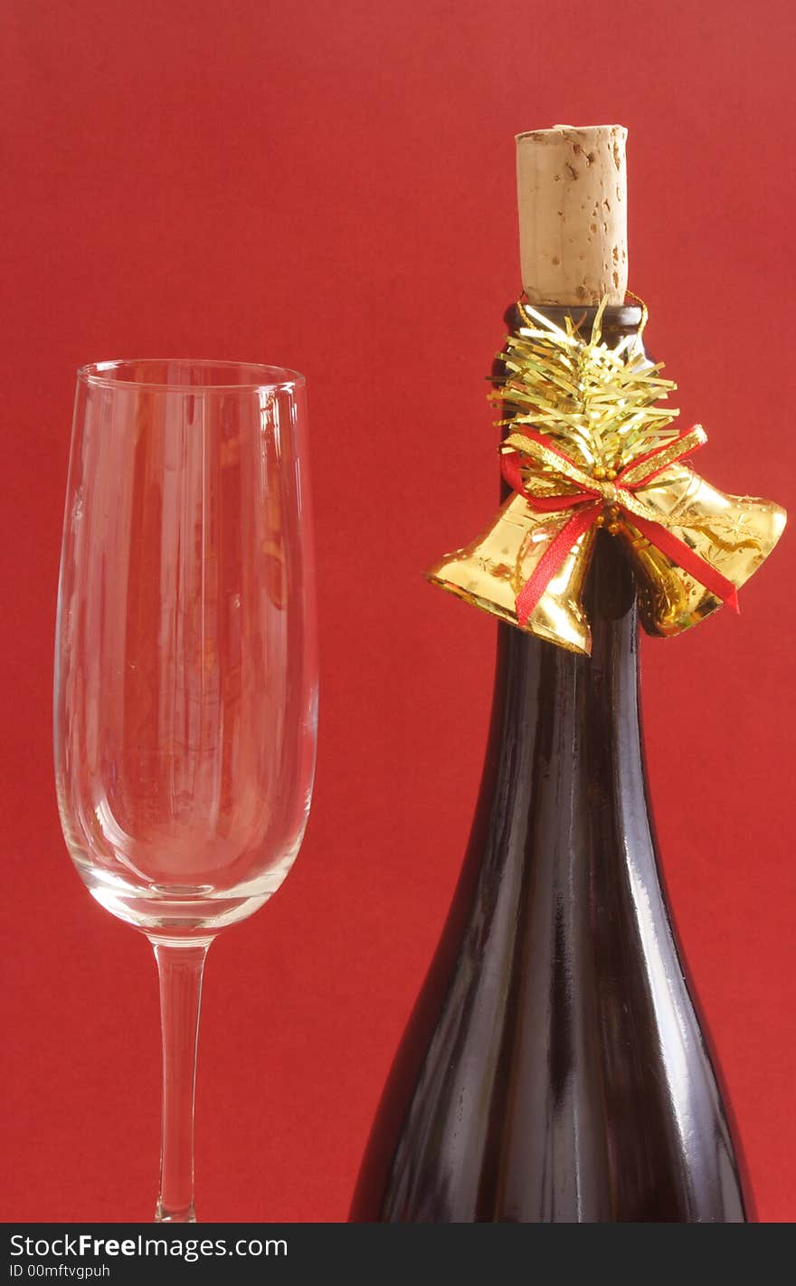 Bottle of champagne with bells and glass. Bottle of champagne with bells and glass