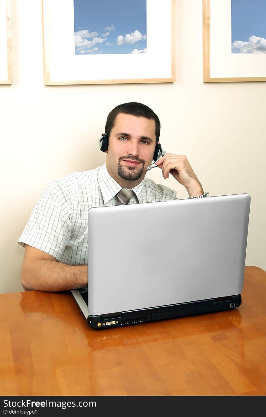 A friendly telephone operator in an office environment.